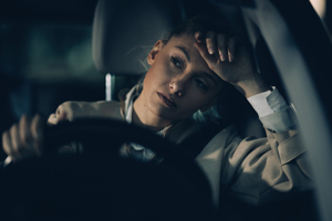 young-woman-driving-tired-drowsy-at-night